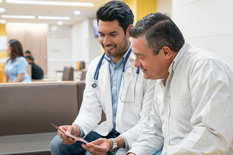 Latino doctor with patient